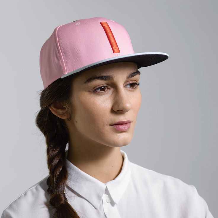 The Blinky is a classic six-panel, baseball-style cap in pink with a contrasting light blue brim and raised embroidery detail in orange. All March Caps feature top eyelets and an adjustable snap-back closure. Each cap comes with a hand-numbered card signed by the designer. Raised Embroidery, Snap Backs, Embroidery Details, Cotton Twill, Light Blue, Baseball, Embroidery, Orange, Pink