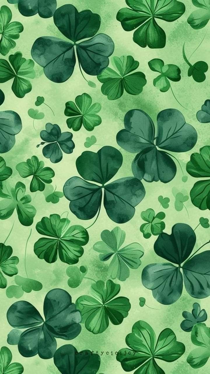 green shamrock leaves on a light green background