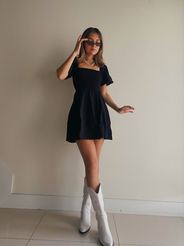 Cowboy boots 90s little black dress inpo Black Dresses Western, Black Dress And White Boots, Cowboy Boots With A Dress, Fancy Cowboy Boots Outfit, Outfit Ideas Cowgirl Boots, Cowgirl Boots And Dress Outfit Wedding, Black Dress With White Cowboy Boots, Cute Dress With Cowboy Boots, Summer Going Out Dress