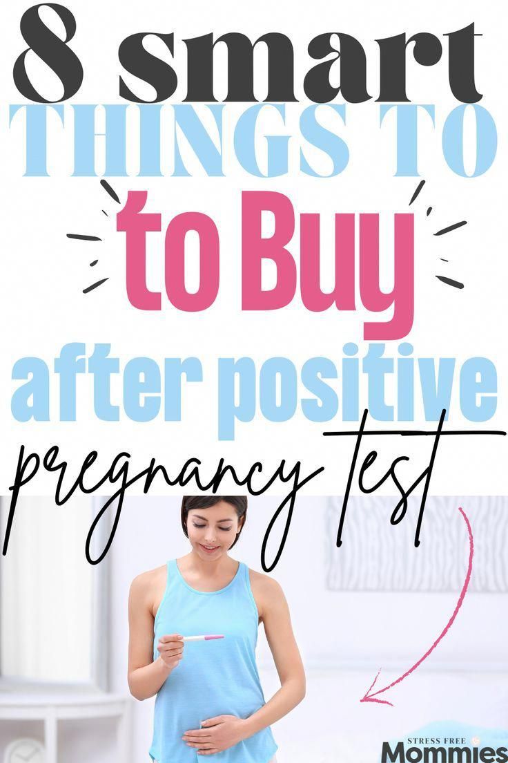 a pregnant woman looking at her belly with the text 8 smart things to buy after positive pregnancy