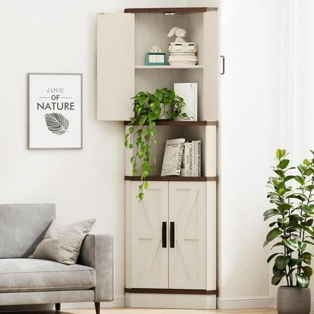 a living room filled with furniture and a potted plant on top of a book shelf