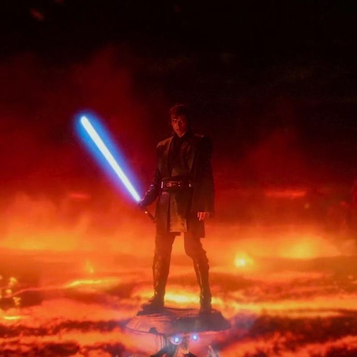 a man standing on top of a cloud covered ground holding a light saber in his hand