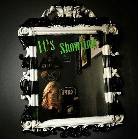 there is a mirror that says it's showtime