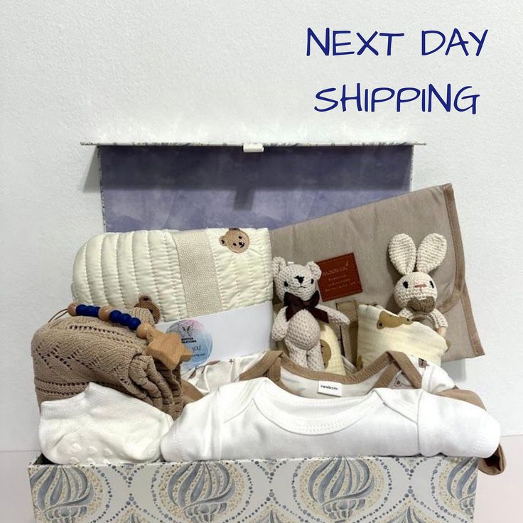 the next day shipping box is filled with baby clothes and stuffed animals, along with other items