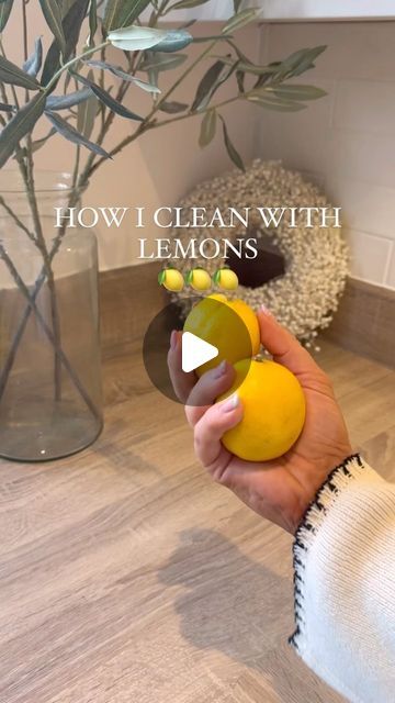 a person holding an object in their hand with the words how i clean with lemons