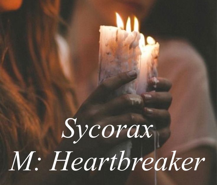 a woman holding a lit candle with the words sycorax m heartbreakerer