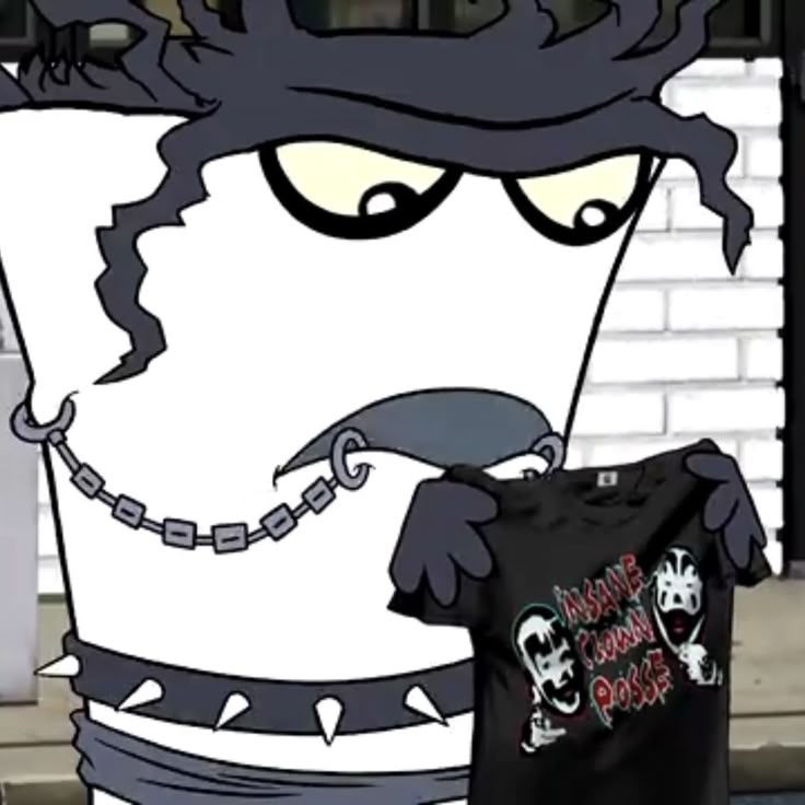 a cartoon character holding up a t - shirt with chains on it's neck