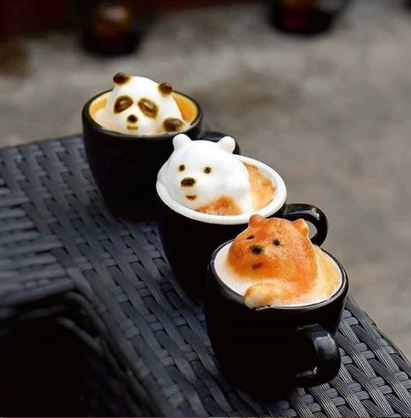 two cups filled with different types of food on top of a table next to each other