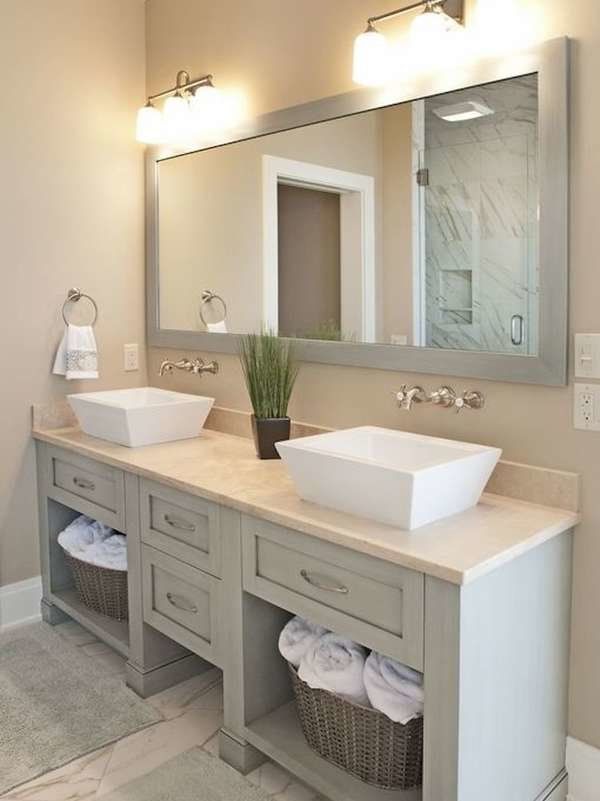 a large bathroom with two sinks and mirrors