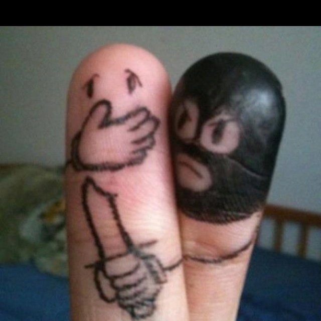 two fingers with faces drawn on them, one is holding the other's hand