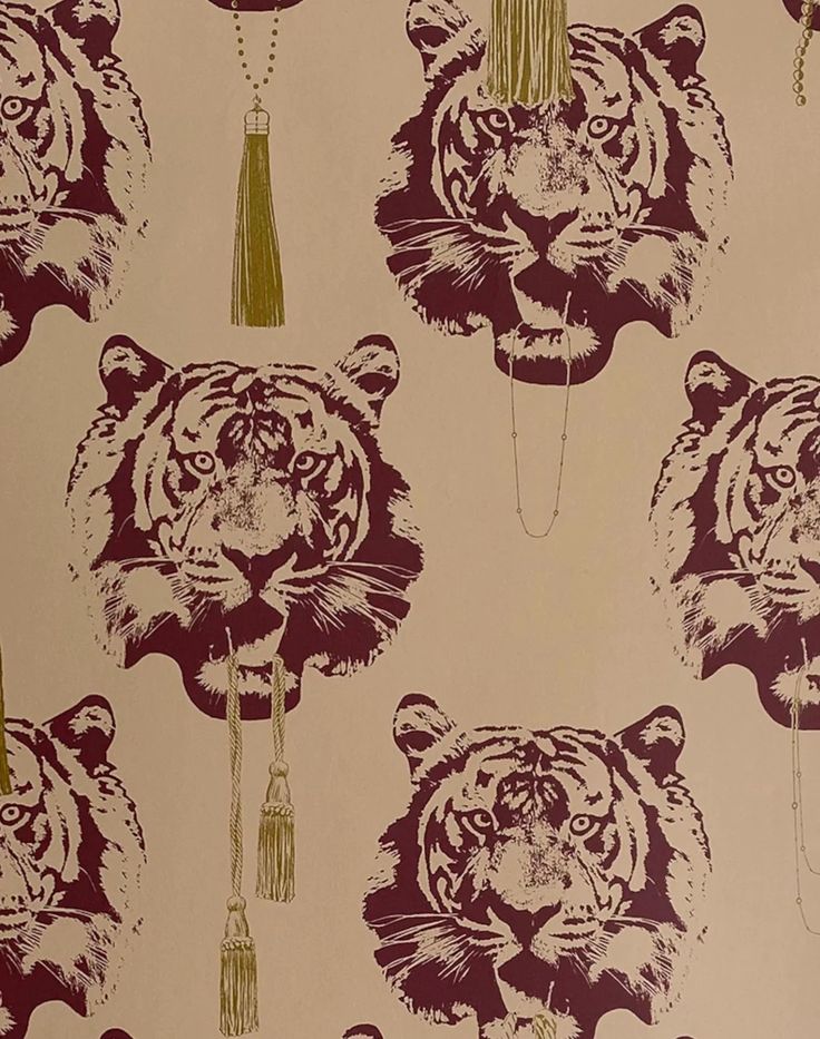 a tiger wallpaper with tassels on it