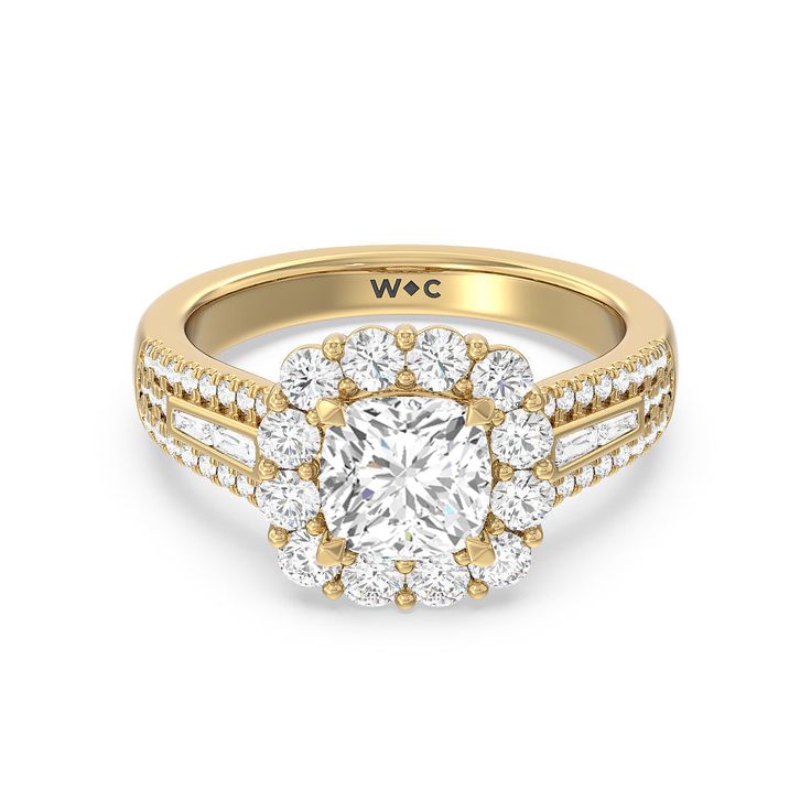 a yellow gold engagement ring with a diamond center surrounded by two rows of round brilliant cut diamonds