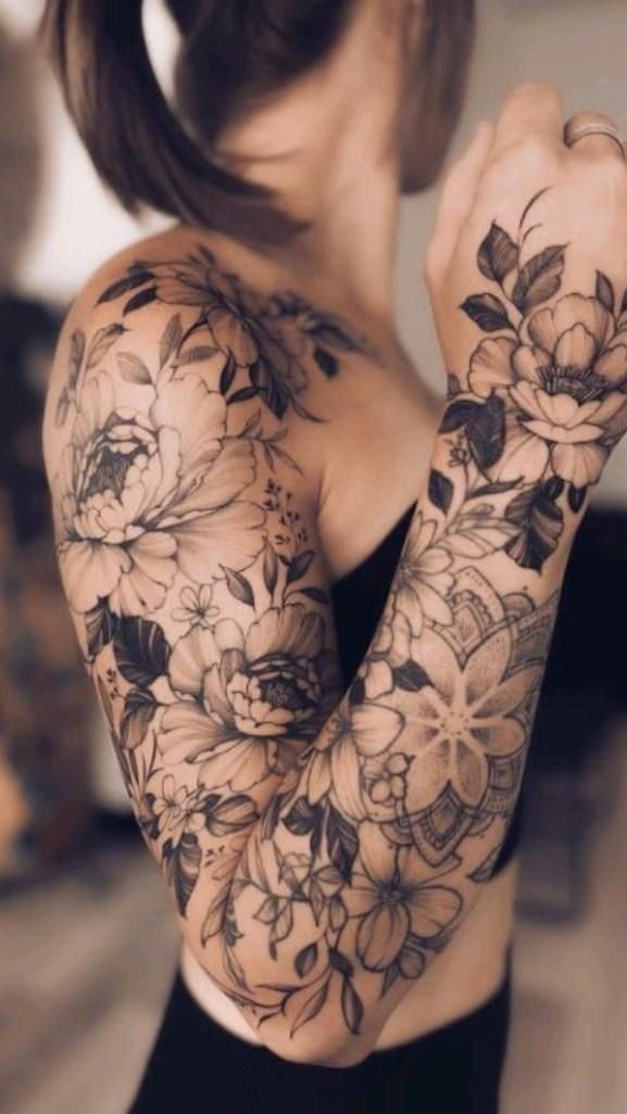 a woman with tattoos on her arms and arm