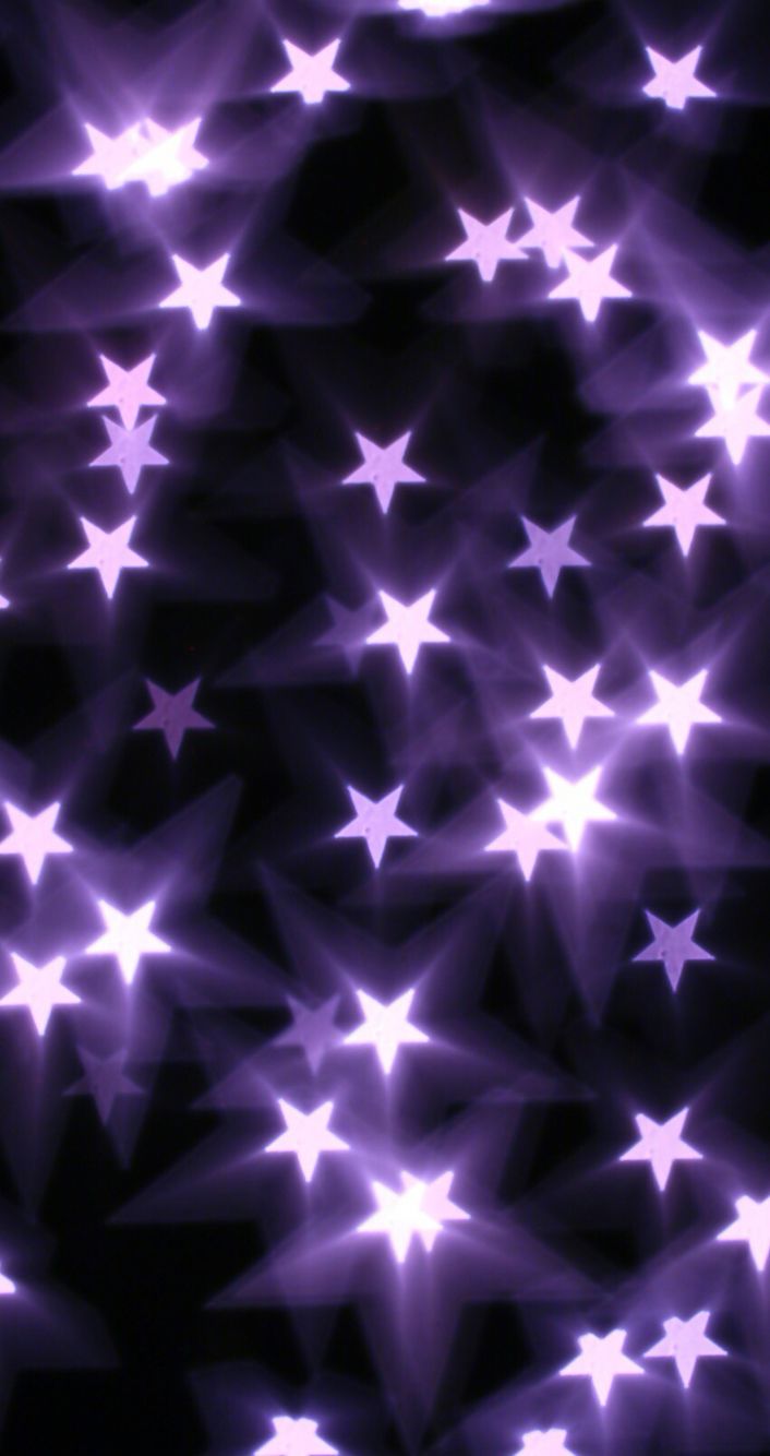 an abstract background with stars in purple and black