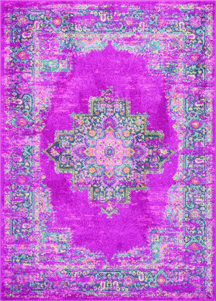 a purple rug with an ornate design in the middle and green, pink, yellow, and blue colors