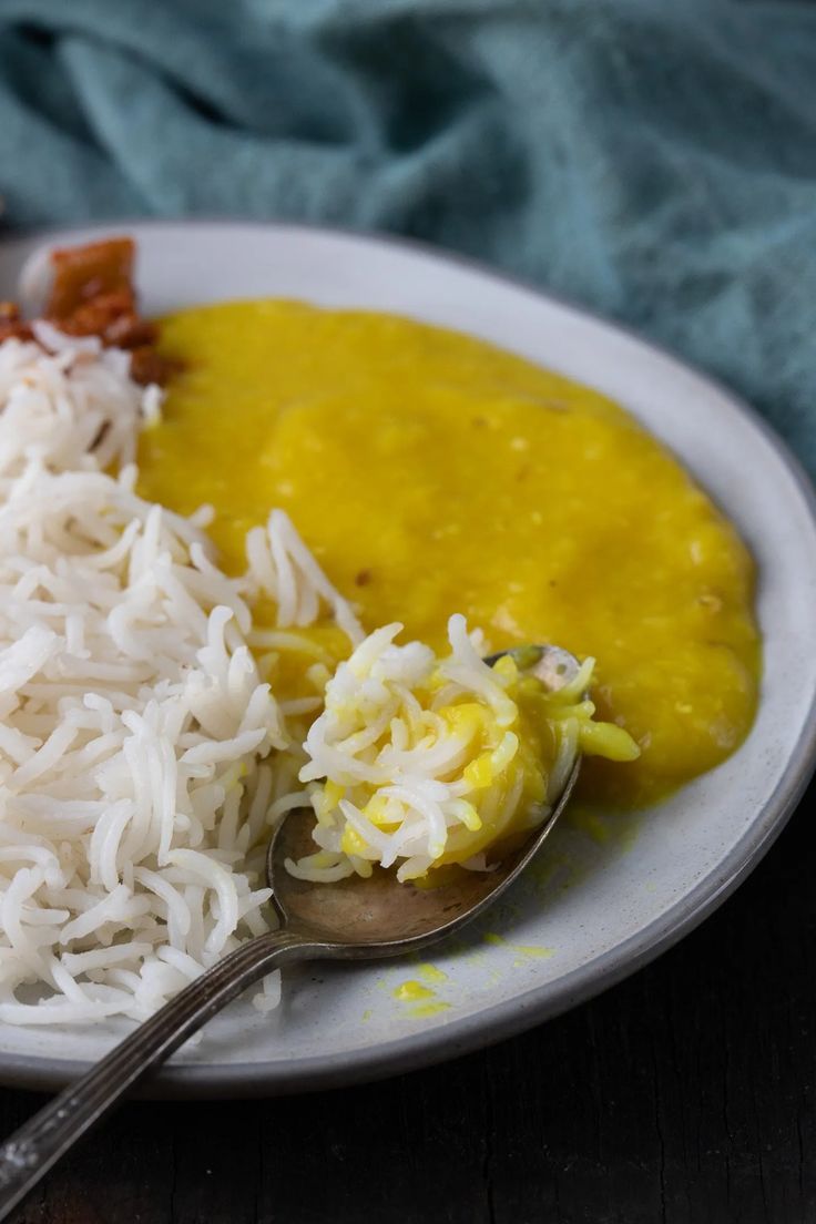 a white plate topped with rice and beans