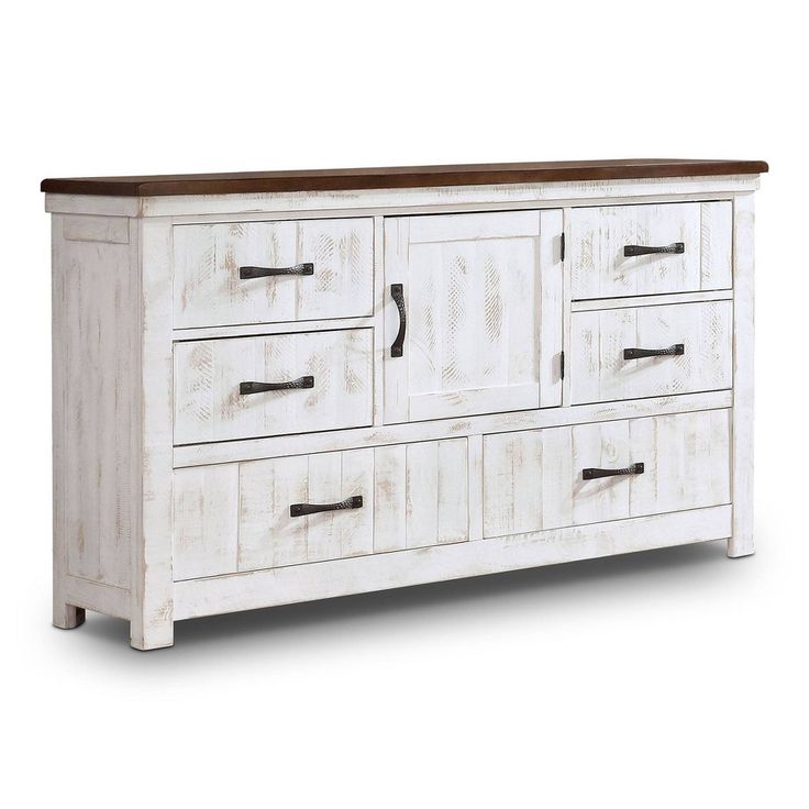 an old white dresser with wooden drawers and doors on the bottom drawer, against a white background