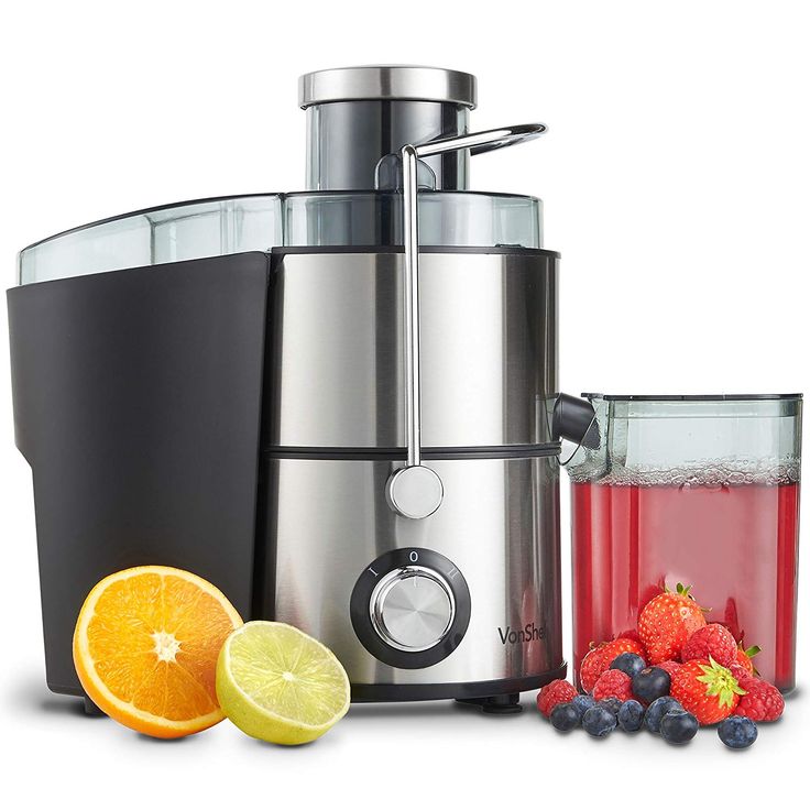 an image of a juicer with fruit on the side and some juice in it