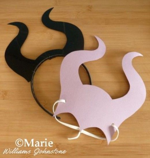 a pair of horns sitting on top of a wooden floor