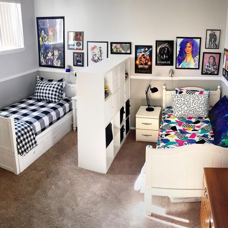 a bedroom with a bed, desk and pictures on the wall next to each other