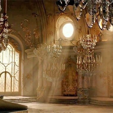 an ornate room with chandeliers and stained glass windows