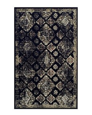 a black and white rug with an ornate design