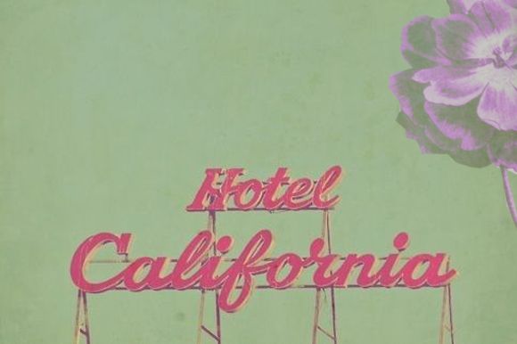 a neon sign that says hotel california on it's side in front of a blue sky