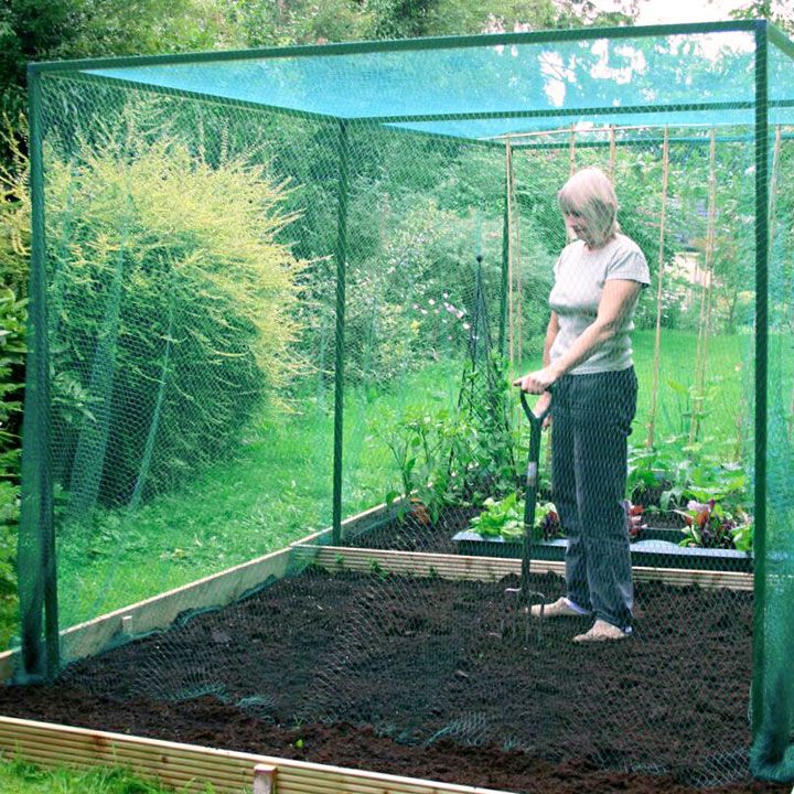 a woman is working in the garden with her shovel