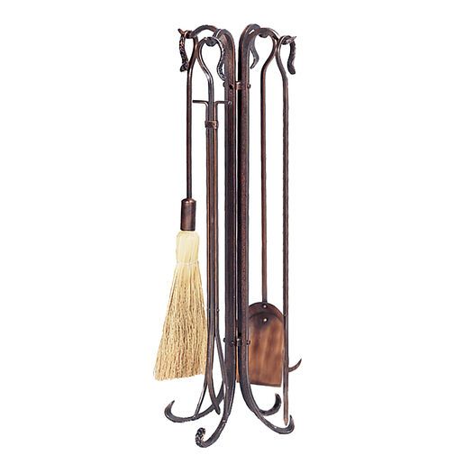 an iron rack with two brooms and a duster on the bottom one has a brush in it