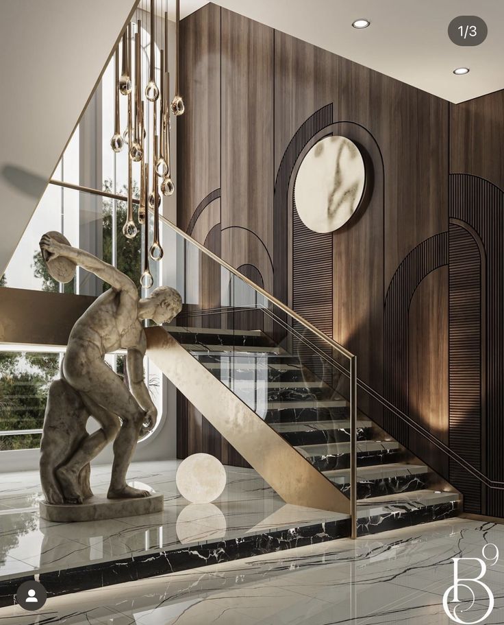 an elegant staircase with marble steps and a statue in the center, along with a clock