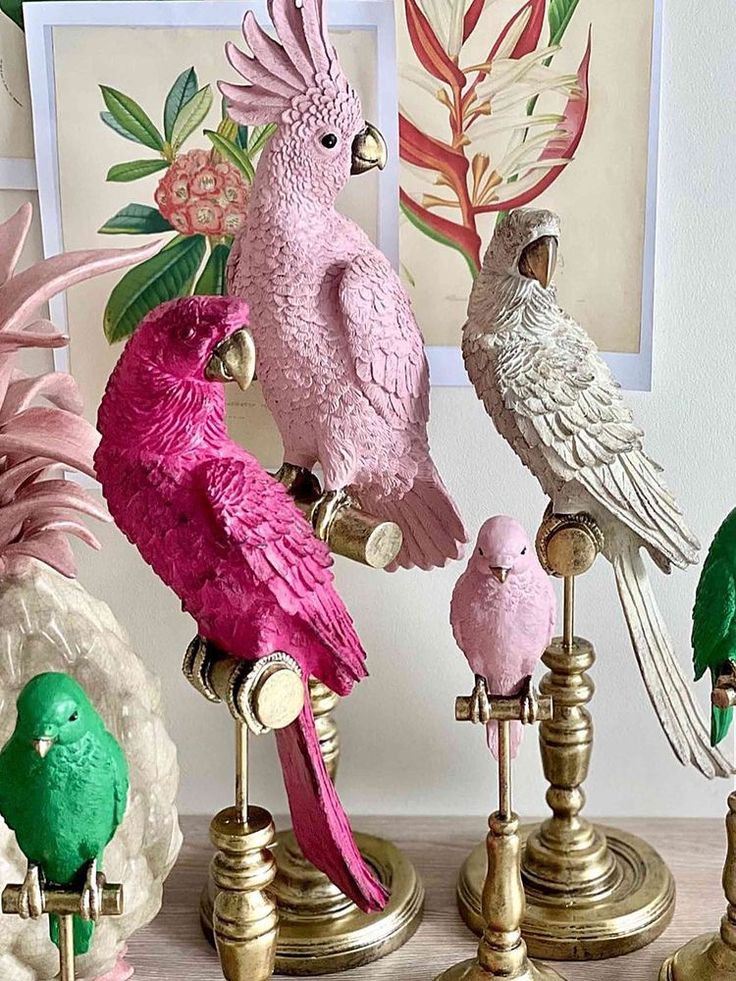 there are many different colored birds on this stand