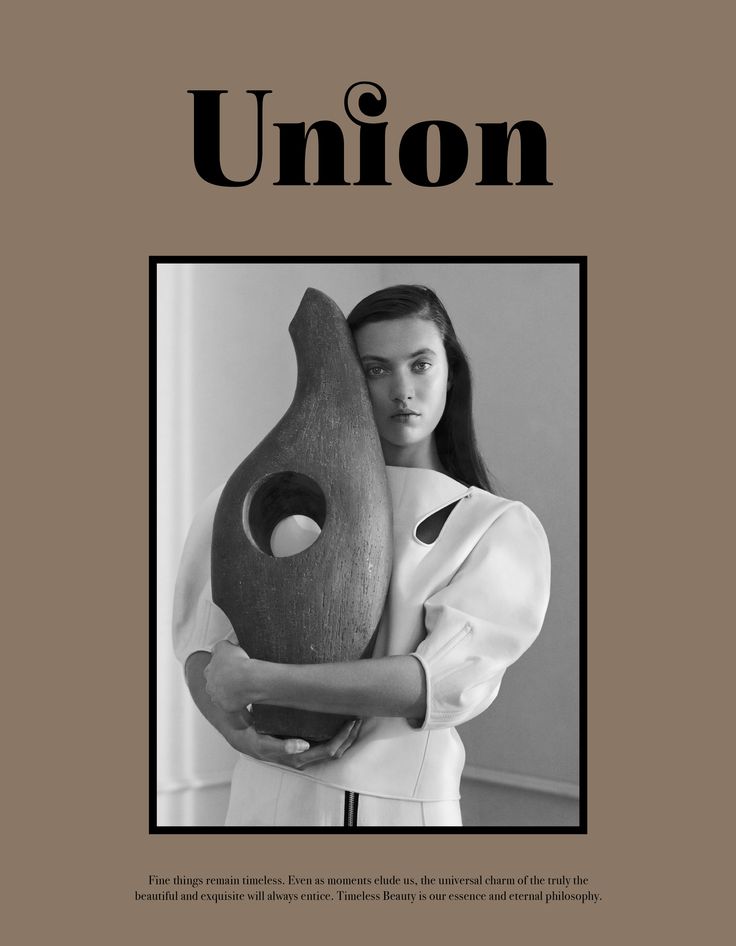 a woman holding a large vase in front of her face with the words union on it