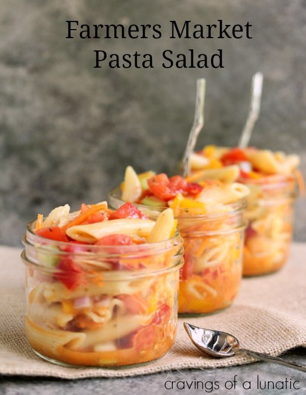 three jars filled with food sitting on top of a table next to a spoon and fork