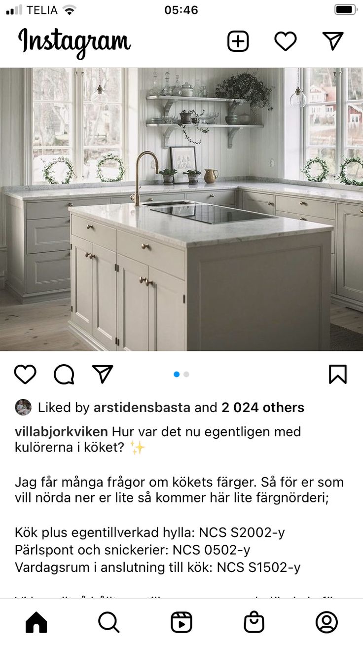 the instagram page on instagram com shows an image of a kitchen with white cabinets and