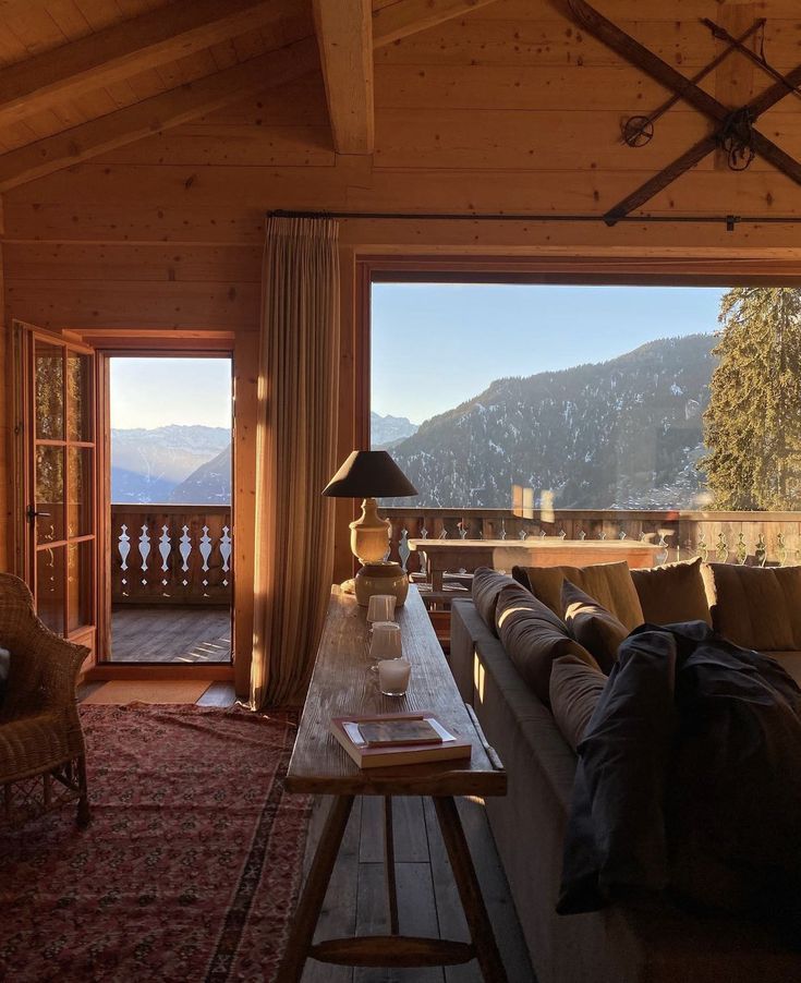 a living room filled with furniture and a large window