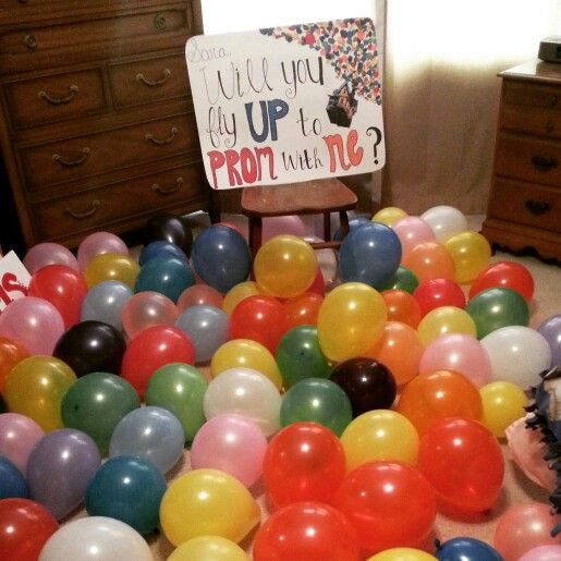 a bunch of balloons that are laying on the floor in front of a sign saying, what will you up to prom with me?