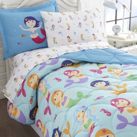 the little mermaid bedding set is blue and has pink, green, purple, and white sheets