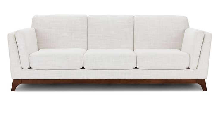 a white couch sitting on top of a wooden frame