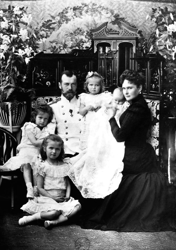 an old black and white photo of a family