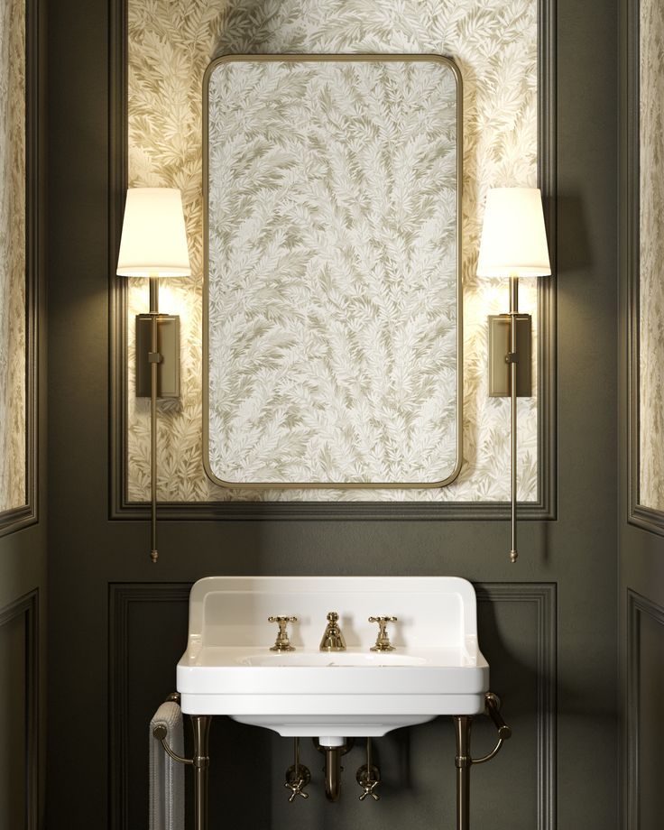 a bathroom sink sitting under a mirror next to a wall mounted faucet and two lamps