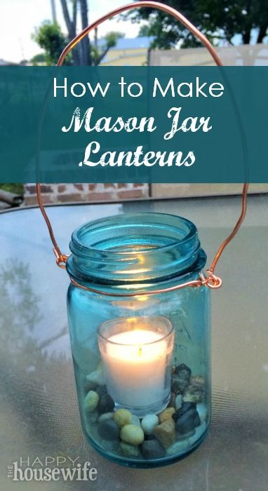 a mason jar filled with rocks and a lit candle