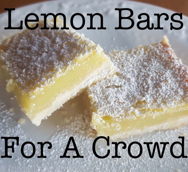 two lemon bars on a plate with powdered sugar and the words lemon bars for a crowd