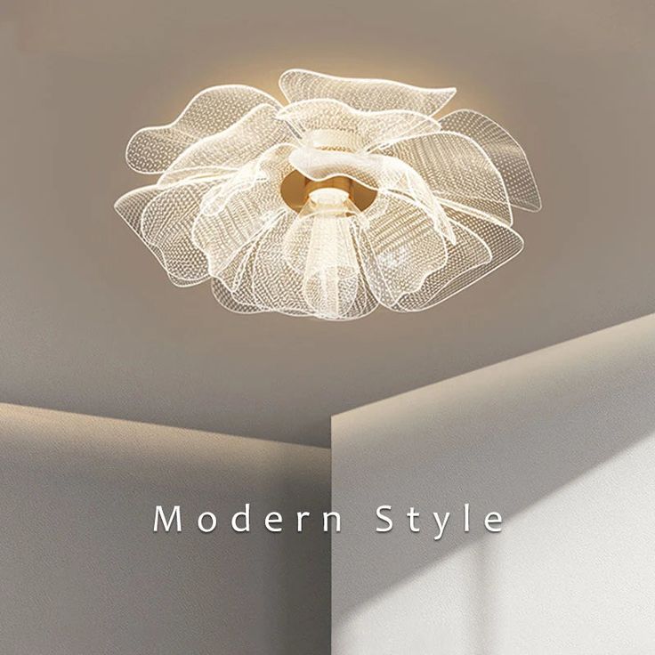 the modern style ceiling light is made from wire and has a white flower design on it