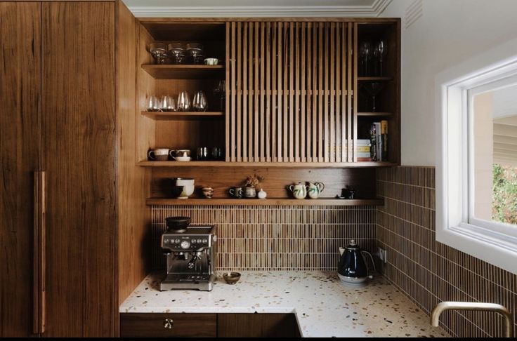 the kitchen is clean and ready to be used as a coffee shop or bar area