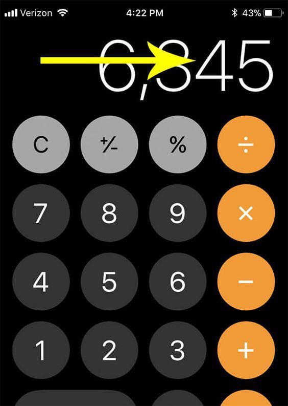 a calculator with an arrow pointing to the numbers on it's screen