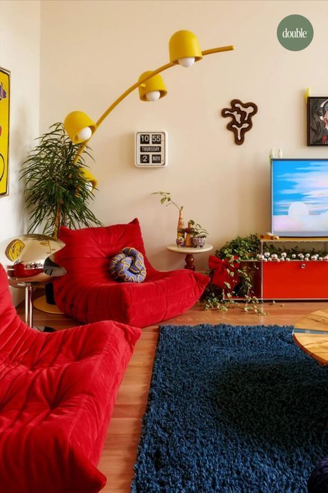 a living room filled with furniture and a flat screen tv