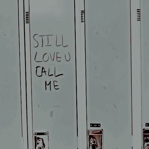 graffiti written on the side of three metal lockers