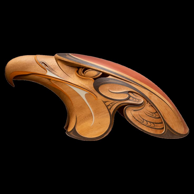 a wooden object with an intricate design on it's body and wings, made out of wood