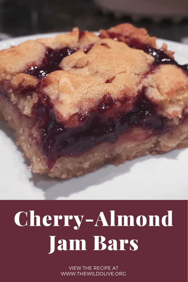 a piece of cherry almond jam bars on a white plate