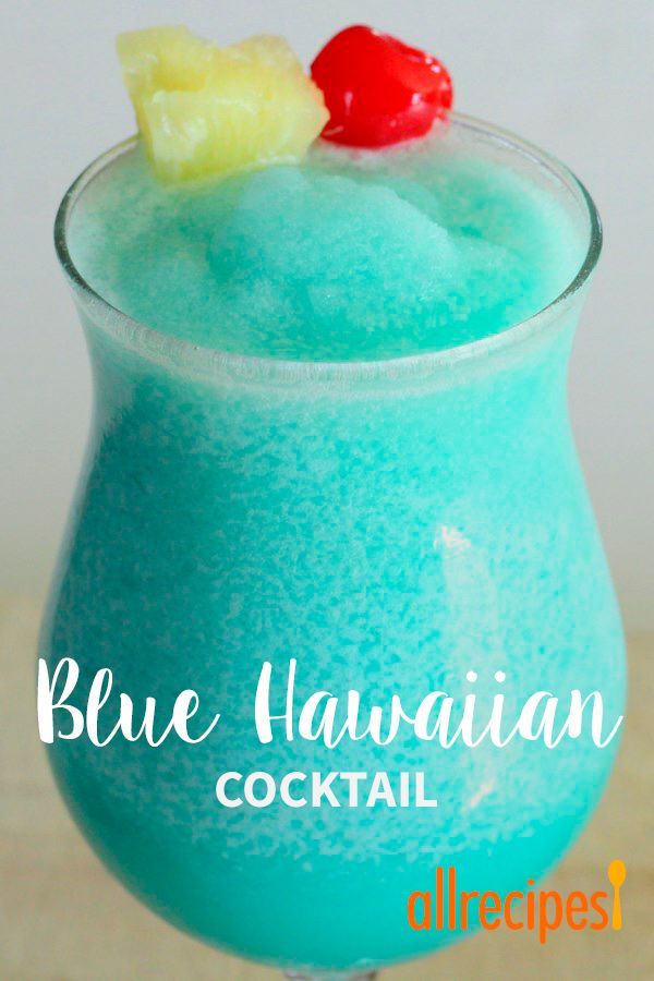 the blue hawaiian cocktail is garnished with pineapple and cherries on top